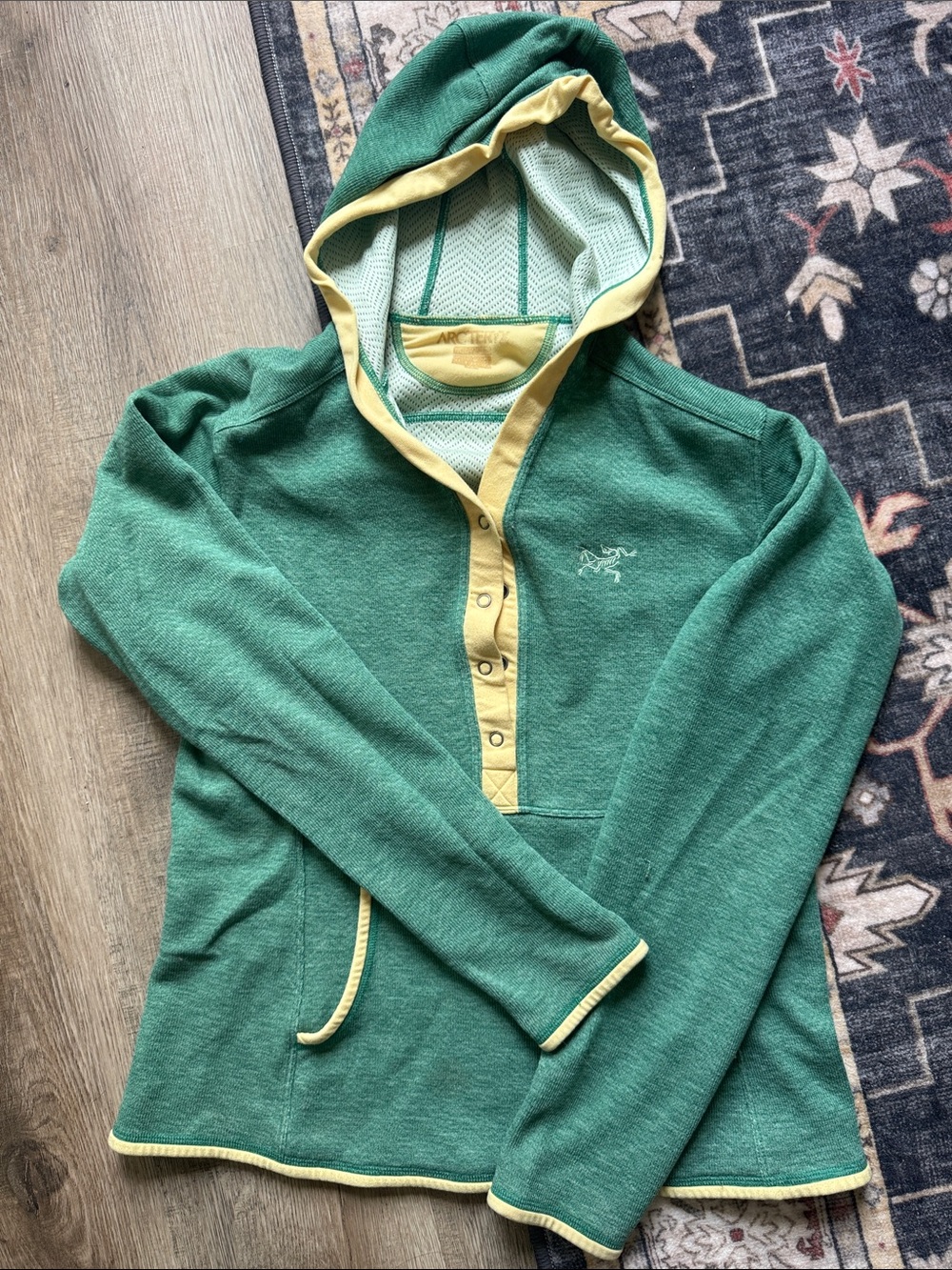 Arcteryx- women’s size Medium- Green Hooded Pullover with Pale Yellow Trim